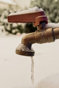 Water freezes as it leaves a tap